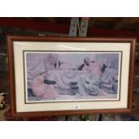 A FRAMED PRINT OF THREE YOUNG LADIES RELAXING