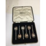 A BOXED SET OF SIX HALLMARKED SHEFFIELD SILVER SPOONS