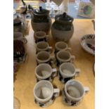 NINE GERMAN STEIN STYLE MUGS AND A RICE AND PASTA STONEWARE CONTAINER