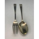 A HALLMARKED LONDON SPOON AND FORK SET ENGRAVED GROSS WEIGHT 51.7 GRAMS