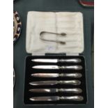 A VINTAGE BOXED SET OF SILVER HANDLED KNIVES AND A PAIR OF HALLMARKED SUGAR NIPS