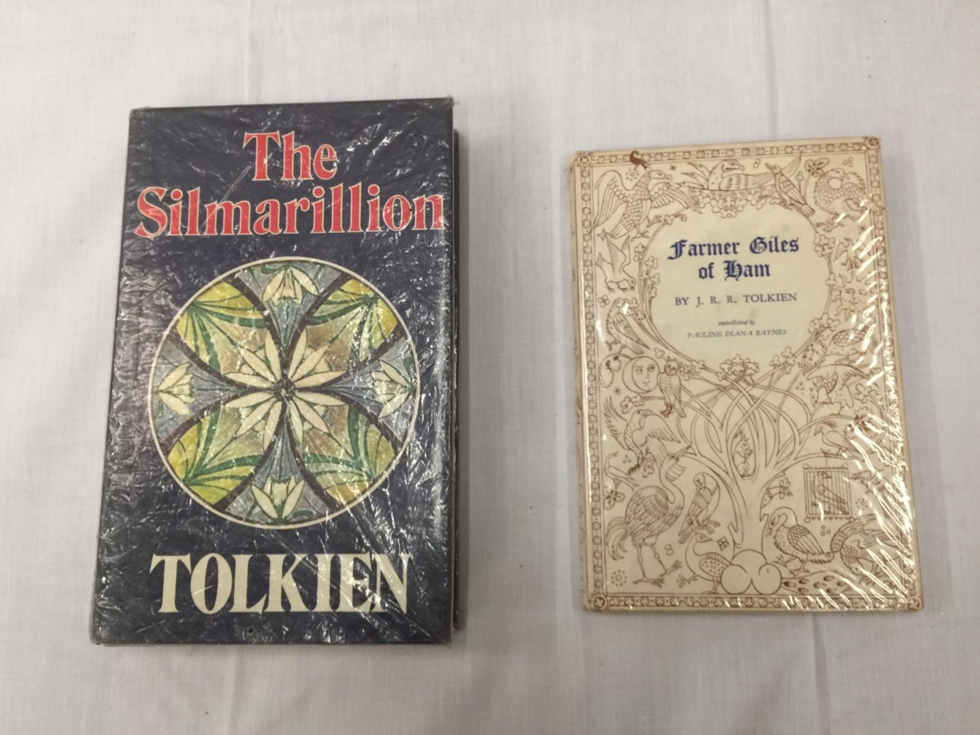 TWO BOOKS BY J.R.R. TOLKIEN, ONE BEING A FIRST EDITION 'THE SILMARILLION' HARDBACK WITH DUST COVER