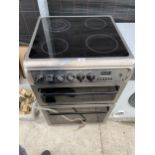 A SILVER HOTPOINT ELECTRIC FREESTANDING OVEN AND HOB