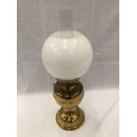 A HEAVY BRASS OIL LAMP WITH GLASS CHIMNEY AND MILK GLASS SHADE, HEIGHT APPROX 50CM