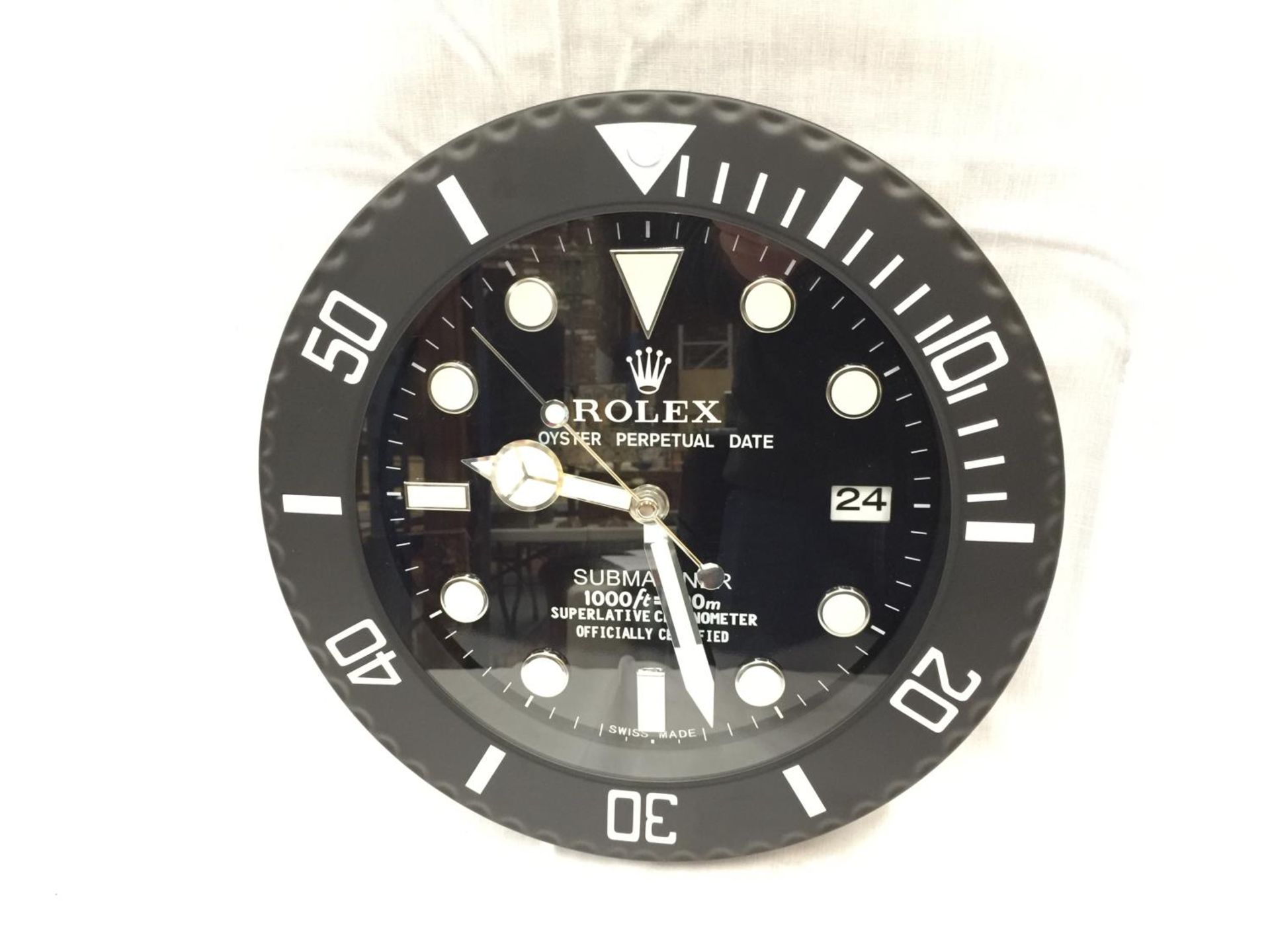 A BLACK DEALERS WALL CLOCK