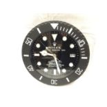 A BLACK DEALERS WALL CLOCK