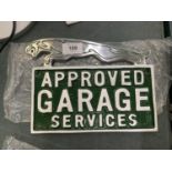 A CHROME JAGUAR APPROVED GARAGE SERVICES SIGN