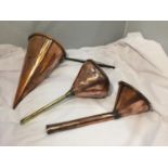 AN ANTIQUE COPPER ALE MULLER WITH TWO COPPER FUNNELS