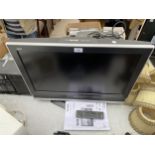 A PANASONIC 26" TELEVISION WITH REMOTE CONTROL AND INSTRUCTION MANUAL