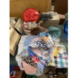 AN ASSORTMENT OF SEWING RELATED ITEMS TO INCLUDE THREAD, MATERIAL AND HATS ETC