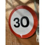 A METAL 30MPH SPEED LIMIT ROAD SIGN