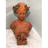 A TERRACOTTA STONE BUST OF A LADY