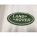 A CAST 'LAND ROVER' SIGN SIZE 17.5CM X 9CM