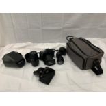 A CANON 35MM SLR CAMERA PLUS EXTRA LENSES, CARRY BAG, ETC