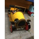 A BRUM PEDAL CAR WITH WORKING HORN AND CRANK HANDLE