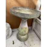 A RECONSTITUTED BIRD BATH WITH PEDASTAL BASE