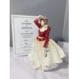 A ROYAL DOULTON LADY OF THE YEAR 1999 'ALICE' WITH CERTIFICAATE OF AUTHENTICITY