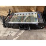 A PUB TABLE FOOTBALL GAME WITH COIN MECHANISM AND KEYS BELIEVED WORKING ORDER BUT NO WARRANTY