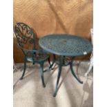 A VINTAGE CAST ALLOY BISTRO SET COMPRISING OF A ROUND TABLE AND ONE CHAIR