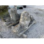 A LARGE PAIR OF RECONSTITUTED STONE LIONS (L:130CM H:70CM)