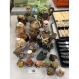 A COLLECTION OF CERAMIC OWLS OF VARIOUS SIZES