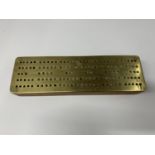 A BRASS TOPPED VINTAGE CRIBBAGE BOARD