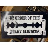 A 'PEAKY BLINDERS' SIGN 35.5CM X 20.5CM