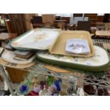 AN ASSORTMENT OF WOODEN TRAYS AND PLACE MATS
