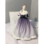 A ROYAL DOULTON FIGURINE OF THE YEAR 2004 MEGAN HN 4539 WITH A CERTIFICATE OF AUTHENTICITY