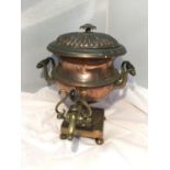 A VINTAGE BRASS AND COPPER TEA URN WITH TAP