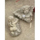 A CONCRETE CHERUB WALL PLANTER AND A FURTHER CHERUB WALL PLAQUE