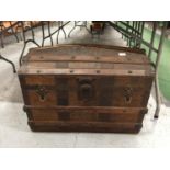 A CIRCA 19TH CENTURY WOODEN BARREL TOPPED CHEST WITH METAL BANDING AND A LEATHER FINISH, PLEASE NOTE