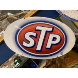 A METAL STP SIGN