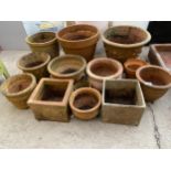 A LARGE COLLECTION OF ASSORTED SIZED TERRACOTTA PLANT POTS