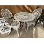 A VINTAGE CAST ALLOY BISTRO SET COMPRISING OF A ROUND TABLE AND TWO CHAIRS