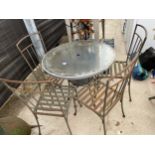 A SMALL BISTRO SET TO INCLUDE A GLASS TOPPED ROUND TABLE AND FOUR METAL CHAIRS