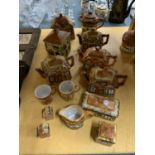 A COLLECTION OF COTTAGE WARE TO INCLUDE TEAPOTS, CUPS, SALT AND PEPPER POT, ETC