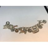 A LINKS OF LONDON SILVER CHARM BRACELET WITH FIFTEEN VARIOUS CHARMS TO INCLUDE HEARTS, GLASSES, FLIP