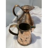 AN ANTIQUE BEATEN COPPER POT WITH LID AND A COPPER JUG