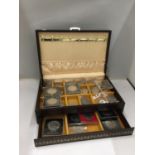 A CANTILEVER JEWELLERY BOX CONTAINING VINTAGE COMMEMORATIVE CROWNS