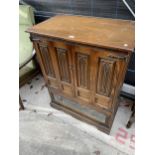 A DARK OLD CHARM ANTIQUE STYLE TV CABINET