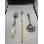 THREE SILVER ITEMS TO INCLUDE A HALLMARKED SHEFFIELD AND MOTHER OF PEARL HANDLED SPOON, A HALLMARKED