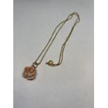 A 9 CARAT GOLD NECKLACE WITH A ROSE PENDANT IN A PRESENTATION BOX GROSS WEIGHT 3.4 GRAMS