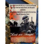 A METAL 'LEST WE FORGET' SIGN