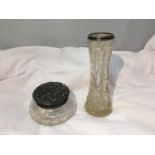 TWO CUT GLASS ITEMS ONE A JAR WITH AN ORNATE HALLMARKED BIRMINGHAM SILVER TOP AND A VASE WITH A