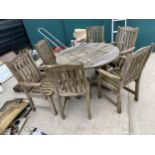 A TEAK PATIO FURNITURE SET TO COMPRISE OF A ROUND TABLE AND SIX CHAIRS