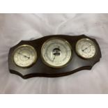 A FRAMED WOODEN WALL HANGING BAROMETER