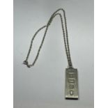 A SILVER INGOT ON A MARKED SILVER CHAIN
