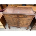 A MID 20TH CENTURY WALNUT CROSSBANDED DRINKS CABINET ON CABRIOLE LEGS, 35" WIDE