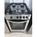 A SILVER AND BLACK ELECTRIC AND GAS OVEN AND HOB
